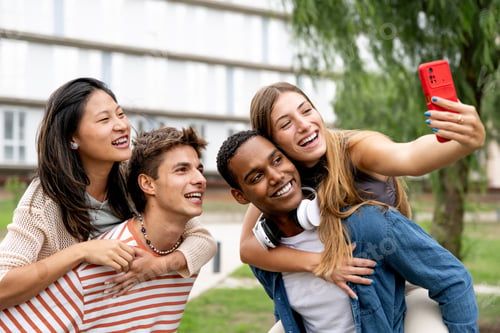 Preview: Happy carefree group of friends taking a selfie laughing.Multiracial young relaxed people having fun