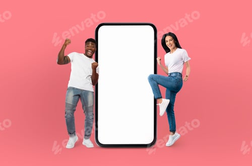 Preview: Smiling multiethnic young man and woman stand beside large smartphone