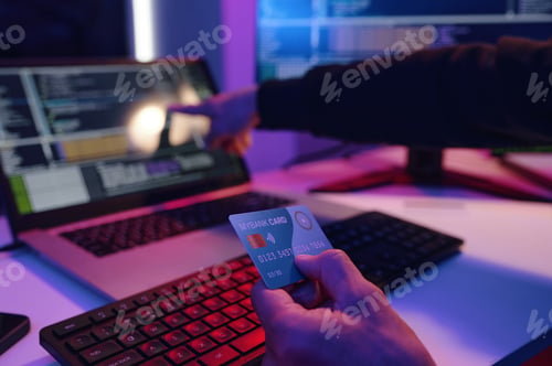 Preview: IT Worker Checking Data Of Credit Card On Computer