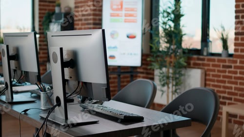 Preview: Empty startup office with computers on desk at workstation