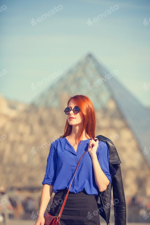 Preview: Redhead women near pyramid in Louver, Paris