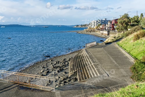 Preview: Stairs On A Sea Wall In West Seattle, Washington Lead To The Water.