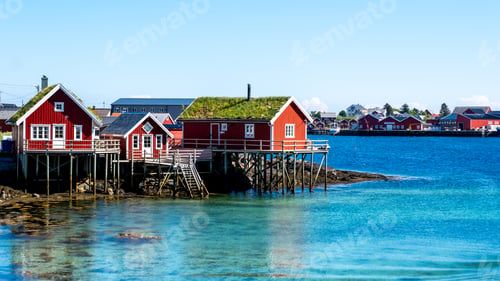Preview: Charming Red Cabins Overlooking the Calm Waters of Norway Scenic Coast, Reine Lofoten Norway