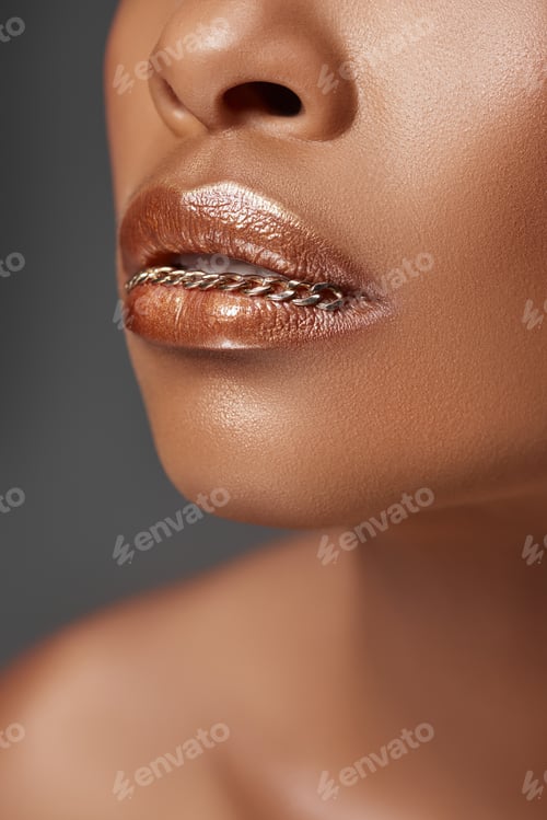 Preview: cropped shot of african american woman with chain in mouth isolated on grey