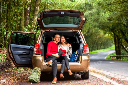 Preview: Couple traveling by car