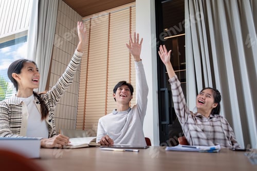 Preview: Enthusiastic Student Raising Hands in Classroom During Interactive Learning Session