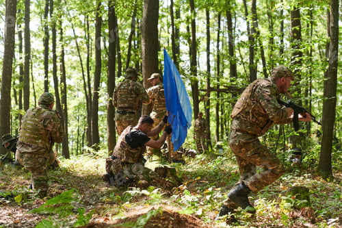 Preview: A disciplined and specialized military unit, donned in camouflage, strategically patrolling and