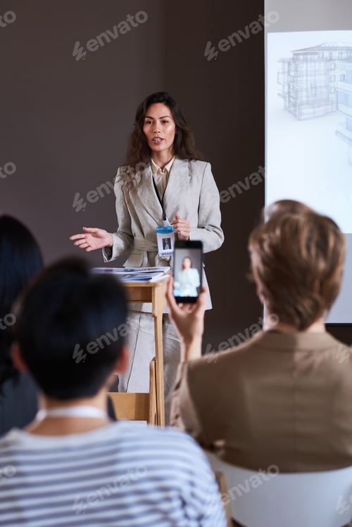 Preview: Woman performing with report at seminar