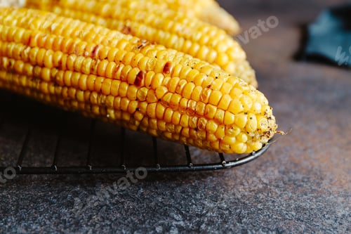 Preview: Roasted or grill corn cob with olive oil and salt on a rack