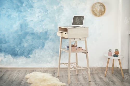 Preview: High wooden table with laptop as stand up workplace in modern interior