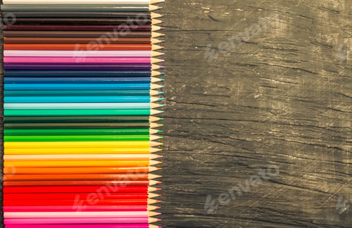 Preview: multicolored pensils and chalk board