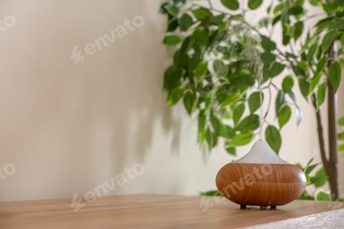 Preview: Aroma oil diffuser lamp on table indoors