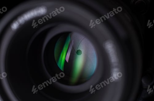 Preview: Camera lens close-up on white background