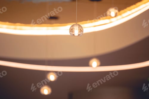Preview: Low angle shot of hanging decorative lights in a room