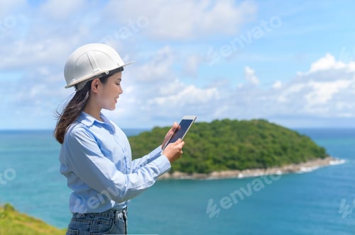 Preview: Engineer Woman Working on Tablet Near Turquoise Sea