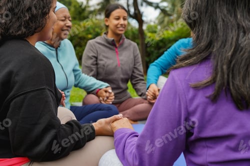 Preview: Women circle doing healing meditation outdoor