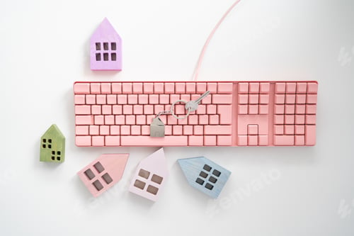 Preview: Colorful mini houses on the office table and pink keyboard
