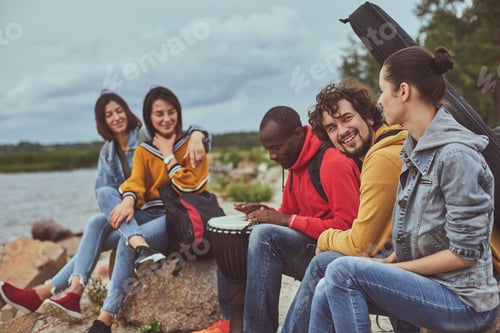 Preview: Having Good Time. Portrait Of Group Of Smile Travelers Enjoying Drum Melody While Playing By