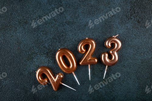 Preview: Holiday background Happy New Year. Numbers 2023 made by gold candles.