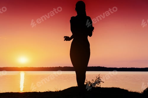 Vista previa: girl at sunset by the lake