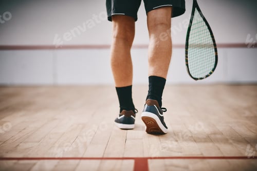 Preview: Cropped shot of an unrecognisable man playing a game of squash