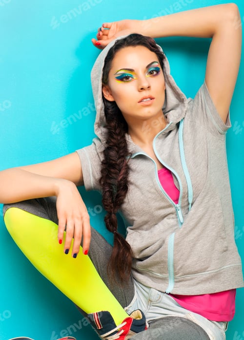 Preview: Portrait of a beautiful model with creative dynamic multicolor make up