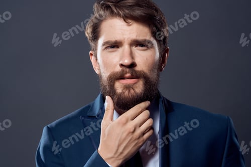 Preview: The man in a suit executive office dark background