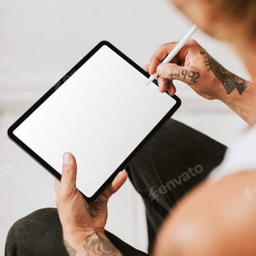 Preview: Tattooed man working on tablet screen mockup