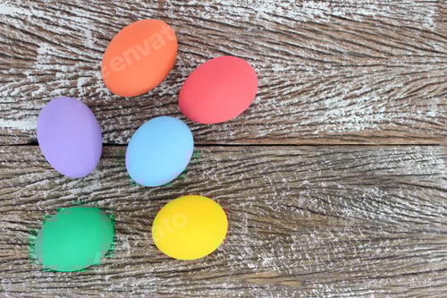 Preview: Colorful Easter Eggs on Distressed Wooden Background