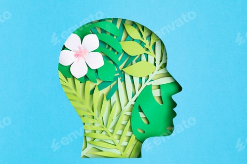 Preview: Papercut head with with green leaves inside. Mental health, psychology, memory, logic, green