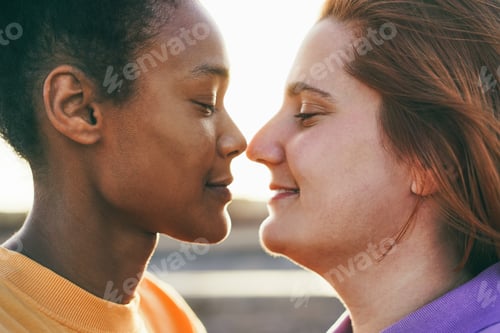 Preview: Happy women gay couple having tender moment outdoor - Lgbt and love concept