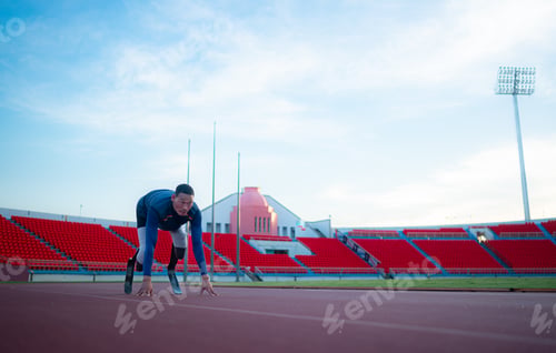 Preview: Disabled athletes prepare in starting position ready to run on stadium track