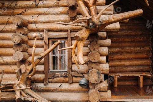 Preview: Beautiful carved wooden house in the village of logs and farmyards