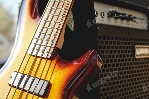 Preview: Playing Guitar. Close up view of brown electric guitar and amplifier