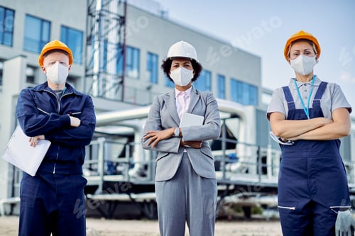 Preview: Team of confident civil engineers with protective face masks and construction site.