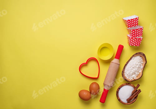 Preview: Ingredients for baking on yellow background