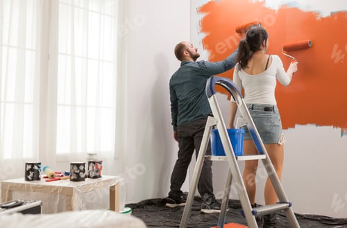 Preview: Family painting walls with orange color