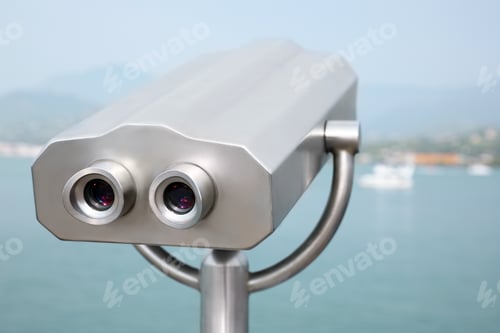 Preview: Metal tower viewer installed near sea. Mounted binoculars