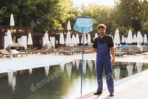 Preview: Pool cleaner holding cleaning net by the poolside