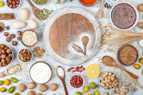 Preview: top view round desk with flour eggs jelly and different nuts on white background fruit nut sugar pie