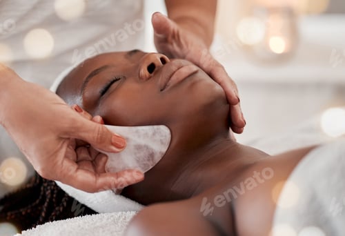 Preview: Black woman, gua sha massage and luxury face treatment of a young female with spa facial. Skincare,