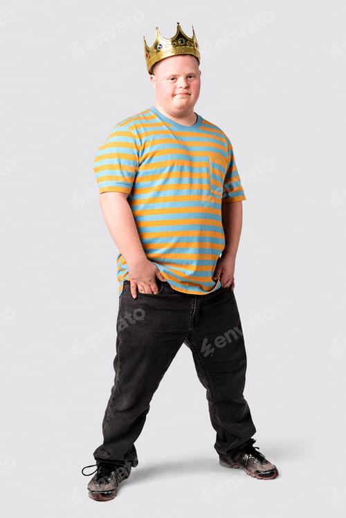 Preview: Confident boy with down syndrome wearing a crown