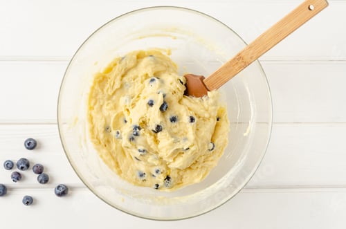 Preview: Raw dough for lemon muffins with blueberries and shtreisel. Recipe step by step