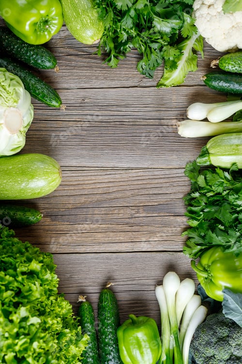 Preview: Frame of green raw vegetables on wooden background. Top view of healthy organic food. Copy space