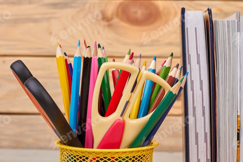 Preview: Close up colorful school supplies background.