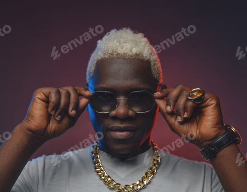 Preview: White haired black guy with sunglasses in white shirt