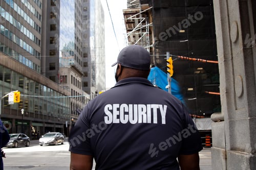 Preview: Security guard in uniform patrolling a residential area.