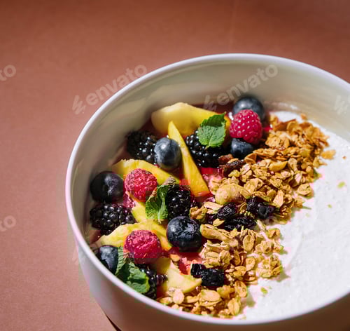Preview: Fresh fruit yogurt bowl on elegant brown background