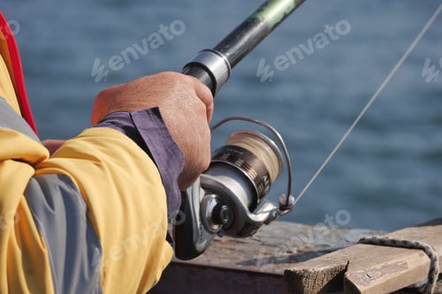 Preview: Fisherman with rod, spinning reel ,