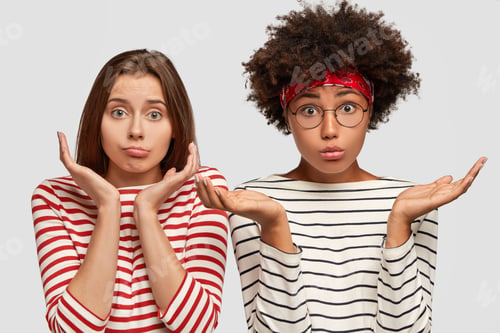 Preview: Doubtful two young clueless girls spread palms, have uncertain facial expressions, cant make desicio